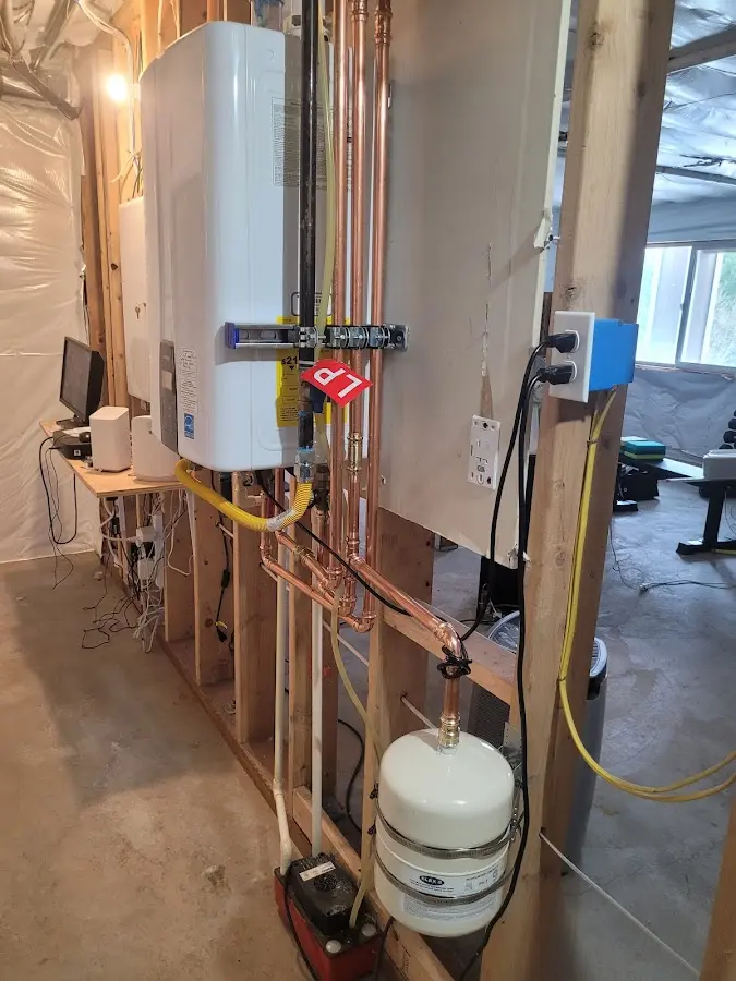 Licensed plumber repairing a kitchen sink in Salem